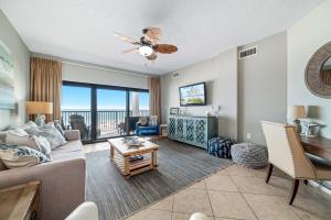 a living room with a couch and a table at The Palms West Unit 515 in Orange Beach