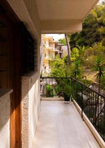 a balcony with a view of a building at GM View Oropos in Oropos