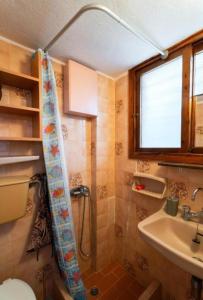 a bathroom with a shower and a sink at GM View Oropos in Oropos +14 photos