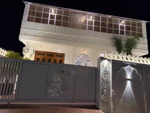 a house with a gate in front of it at night at Vista villa in Pushkar