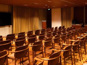 a room with rows of chairs and a podium at Mondrian Bordeaux Les Carmes in Bordeaux +91 photos