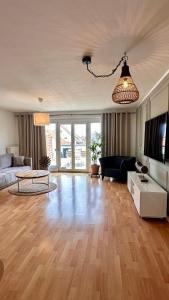 a living room with a couch and a table at AMAO-Sienna - Walk to Europa-Park - Terrace - 6 Guests in Rust