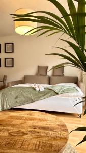 a bedroom with a bed with a stuffed animal on it at AMAO-Sienna - Walk to Europa-Park - Terrace - 6 Guests in Rust