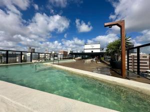 a swimming pool on the roof of a building at Restinga 305- Flat vista mar no Bessa - ASKA in João Pessoa
