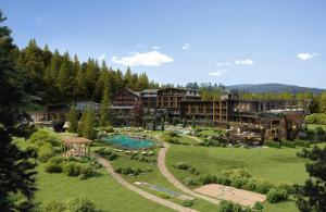 an aerial view of a resort with a pool and trees at Viktoria Alpine Hideaway in Avelengo