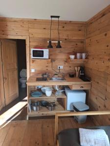 a kitchen with a sink and a microwave at Sailor Setubal in Setúbal +1 photo