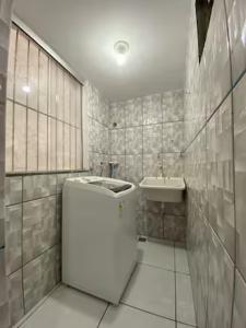 a white bathroom with a tub and a sink at Ed The Rock in Belém +69 photos