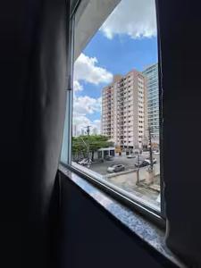 a view of a city street from a window at Ed The Rock in Belém