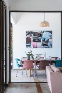 a dining room with a table and chairs at Villa Baki - Luxe & Ocean View in Le Morne