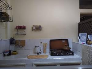 a kitchen with a stove and a counter top at Casa di Medina - Authentic Stay with Parking in Tiznit +24 photos