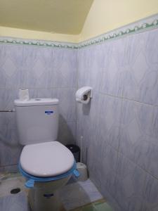 a bathroom with a white toilet in a room at Casa di Medina - Authentic Stay with Parking in Tiznit