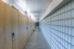 a hallway with wooden lockers in a building at HI Ponte de Lima - Pousada de Juventude in Ponte de Lima