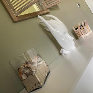 a table with a vase and a box of shells at Résidence Petru-Maria in Propriano +46 photos
