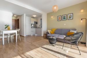 a living room with a couch and a table at Villa REANA in Brela