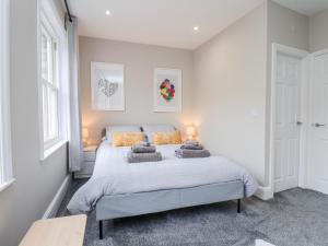 a bedroom with a bed with two pillows on it at Brinkleys Nook in Whitby