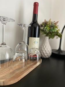 a bottle of wine and two glasses on a table at Weingut Lehnert-Später in Piesport