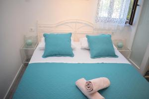 a bedroom with a bed with two towels on it at Villa Marko in Ljubitovica +48 photos