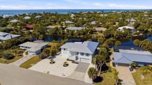 an aerial view of a house with the ocean at Club Red in Sanibel