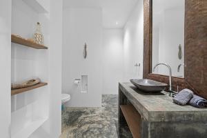 a bathroom with a sink and a toilet at Vista Alegre by Boutique Bonaire Unique Resorts in Kralendijk +21 photos