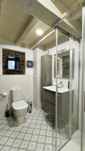 a bathroom with a toilet and a sink at Casa Yañez in Chantada +84 photos
