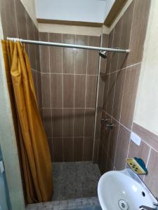 a bathroom with a sink and a shower at GuateDo Atitlán Loft & Rooftop in Panajachel
