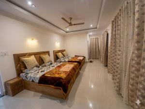 a bedroom with a large bed in a room at The Meer Mansion in Srinagar