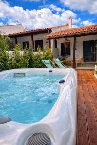 a plunge pool in a backyard with a house at Villa Maison Rosabianca - Costa Smeralda by Rosabianca Collection in Cugnana Verde