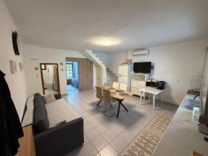 a living room with a couch and a table at Halkidiki in Skala Fourkas