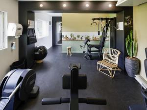 a gym with treadmills and exercise equipment at ibis Styles Chalon sur Saône in Chalon-sur-Saône
