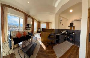 a room with a desk and a couch and a desk at Cho Suites in Leh