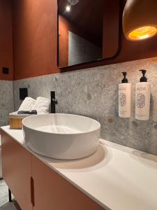 a bathroom with a large white sink on a counter at The 9 loft in Pyrgos