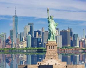 an image of the statue of liberty in front of a city at Steps from Times Square - Cozy Room - Shared Bath in New York