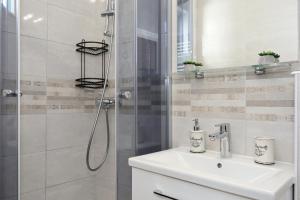 a bathroom with a shower and a sink and a shower at Apartment Tea with Sea View in Petrcane +71 photos