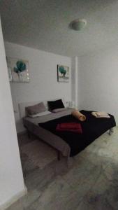 a bedroom with a bed in the corner of a room at Casa Pape e Toni in El Cotillo