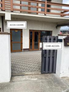 two parking meters in front of a building at Stadium Side Rooms in Craiova
