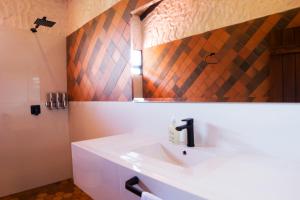 a bathroom with a sink and a mirror at Villa Germana in Paipa +41 photos