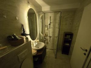a bathroom with a toilet and a sink and a shower at ENA Lux in Novi Pazar +15 photos
