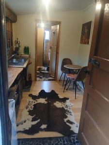 a kitchen with a rug on the floor at Edens retreat in Upper Moutere