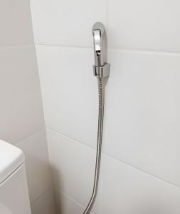 a shower in a bathroom with a shower head at Lapa Enredo in Rio de Janeiro +55 photos