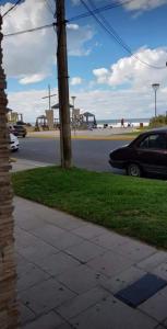 a car parked on the side of a street at San bernardo edificio frente al mar in San Bernardo