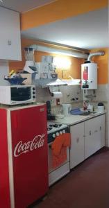 a coca cola refrigerator in a kitchen with at San bernardo edificio frente al mar in San Bernardo +9 photos