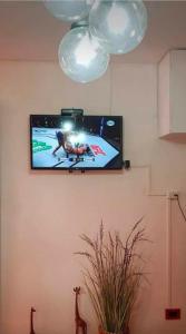 a flat screen tv hanging on a wall at San bernardo edificio frente al mar in San Bernardo