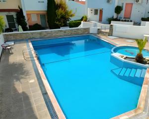 a swimming pool with blue water in a house at Villa Estrella - Pool - Sunset Views - 200m Siviri Beach in Siviri