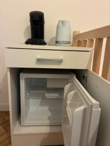 a white counter top with a drawer in a kitchen at Duplex with Jacuzzi - Grand place Arras in Arras