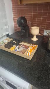 a counter top with a box of food on it at Brisa do Mar in Leiria