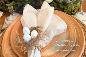 two eggs in a nest on top of a table at Hotel Maui Maresias in Maresias