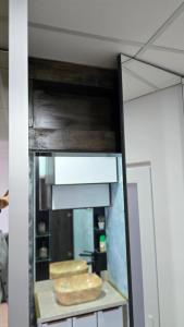 a mirror in a room with two bread at Totall Panoramic Studio in Moreni +33 photos