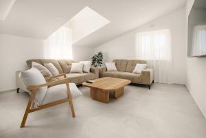 a living room with a couch and a coffee table at Apartments Bianca Vodice in Vodice