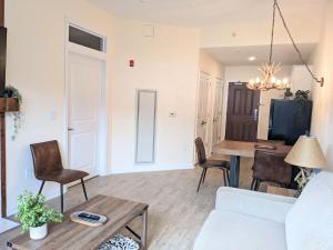 a living room with a couch and a table at Appalachian TOP 4TH FLOOR Studio plus amazing views in Vernon Township
