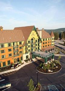 a large hotel with a parking lot in front of it at Appalachian TOP 4TH FLOOR Studio plus amazing views in Vernon Township